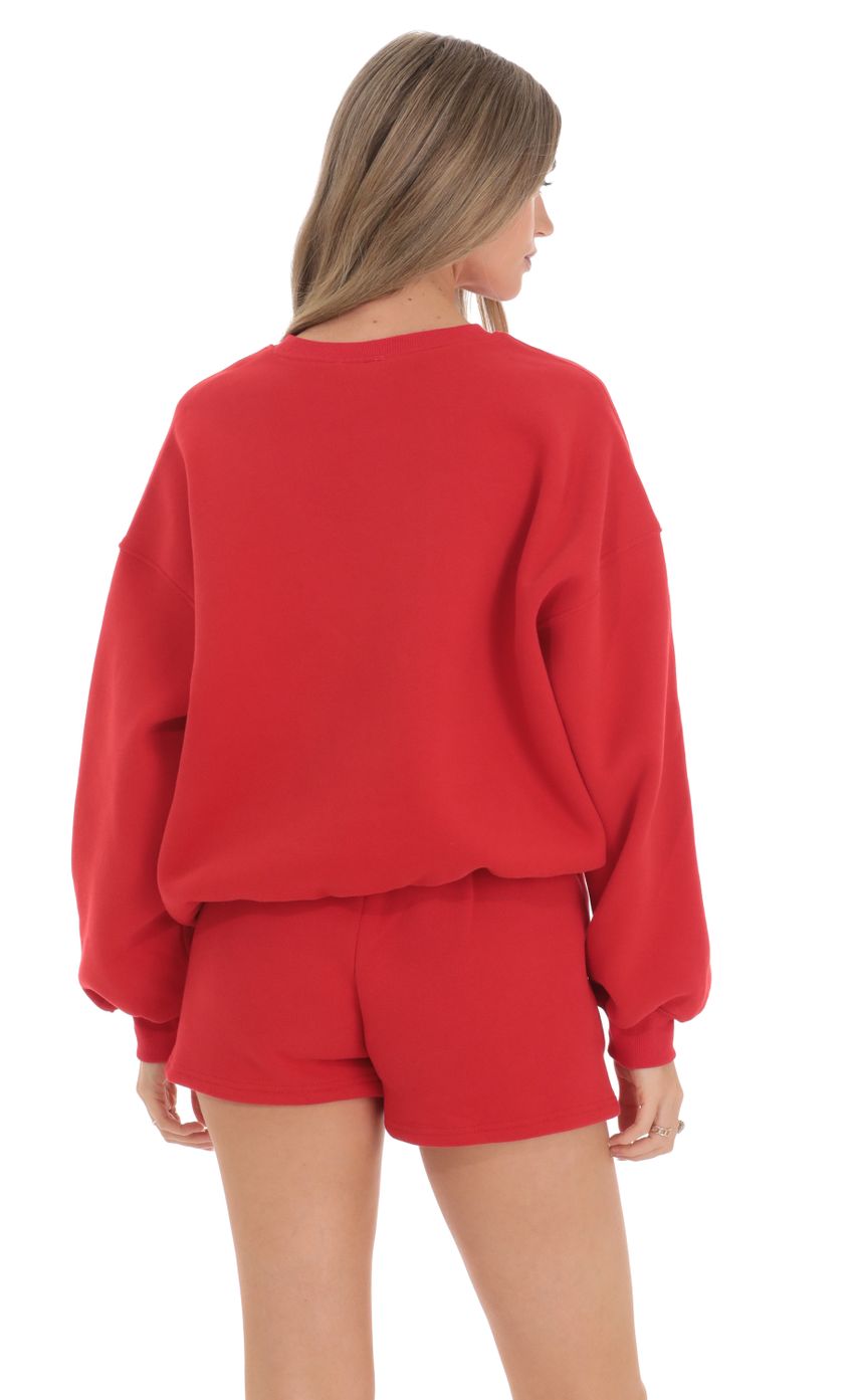 Picture Fleece Jumper in Cherry Red. Source: https://media.lucyinthesky.com/data/Feb24/850xAUTO/0fe19ac6-eea0-4091-be1c-5933f3aec1e4.jpg