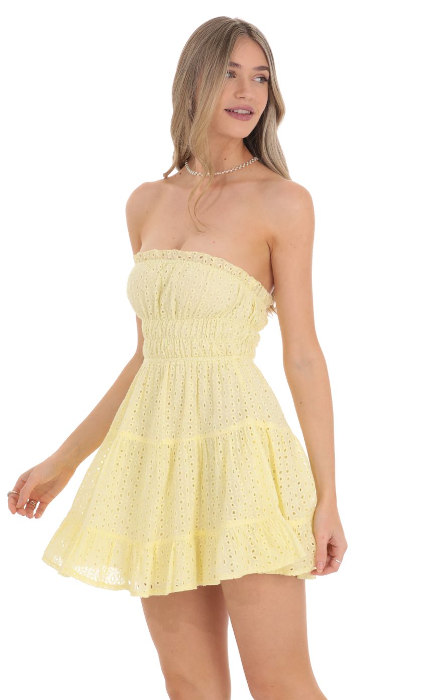Picture Strapless Eyelet Dress in Yellow. Source: https://media.lucyinthesky.com/data/Feb24/850xAUTO/1e357660-a9fb-4acc-bde2-d12b090dd6f3.jpg
