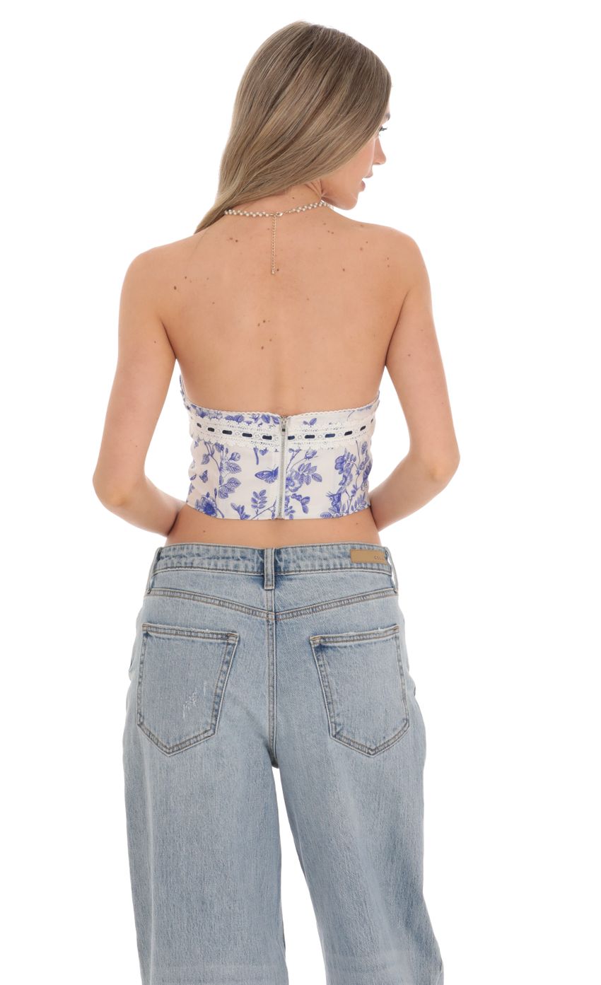 Picture Blue Floral Corset Top in White. Source: https://media.lucyinthesky.com/data/Feb24/850xAUTO/e2c1cd12-a29a-4cc4-a8e0-db3cb15af2dd.jpg