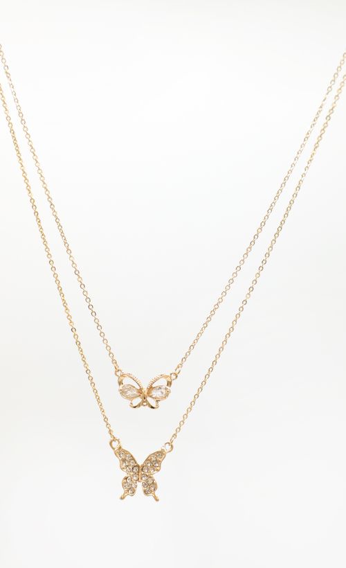 Picture Fly Bae Butterfly Necklace in Gold. Source: https://media.lucyinthesky.com/data/Jan22_1/500xAUTO/1J7A5402.JPG