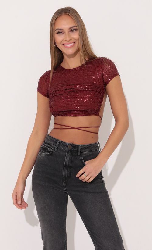 Picture Veronica Open Back Top in Red Sequin. Source: https://media.lucyinthesky.com/data/Jan22_1/500xAUTO/1V9A3457.JPG