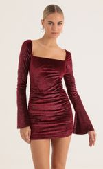 Picture Carmen Glitter Velvet Bell Sleeve Dress in Red. Source: https://media.lucyinthesky.com/data/Jan23/150xAUTO/cee52165-ab9e-4f28-a7a7-dc3c8f6a7d3c.jpg