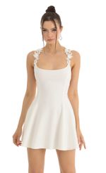 Picture Linnea Floral Flare Dress in White. Source: https://media.lucyinthesky.com/data/Jan23/150xAUTO/daca56cd-b0d5-4117-9da7-3b26e9c99cef.jpg