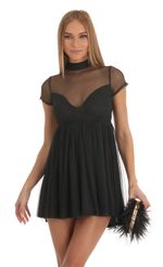 Picture Cecily Sheer Mock Neck Baby Doll Dress in Black. Source: https://media.lucyinthesky.com/data/Jan23/150xAUTO/e7bd5c05-6dd5-4c69-aaa9-65d82ad5d69e.jpg