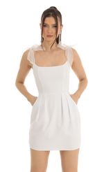Picture Mariela Bow Mini Dress in White. Source: https://media.lucyinthesky.com/data/Jan23/150xAUTO/ef510cf7-45f2-4ed6-867c-c6ea378f5b01.jpg