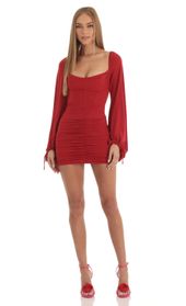 Picture thumb Jacky Long Sleeve Corset Dress in Red Glitter. Source: https://media.lucyinthesky.com/data/Jan23/170xAUTO/58e0ca79-f127-4abc-834e-f98b022a21b7.jpg
