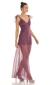 Picture thumb Tia Shoulder Bow A-Line Illusion Maxi Dress in Purple. Source: https://media.lucyinthesky.com/data/Jan23/170xAUTO/68679244-be2b-46b9-b362-8ec8b58873dc.jpg