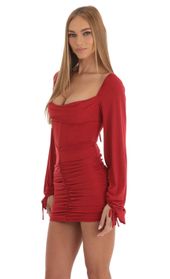 Picture thumb Jacky Long Sleeve Corset Dress in Red Glitter. Source: https://media.lucyinthesky.com/data/Jan23/170xAUTO/8363a279-d81f-4779-aee8-5d484b19a30a.jpg