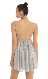 Picture thumb Liora Checkered Sequin Baby Doll Dress in Silver. Source: https://media.lucyinthesky.com/data/Jan23/170xAUTO/ac303971-48a9-40ce-947c-985b3f803bfe.jpg