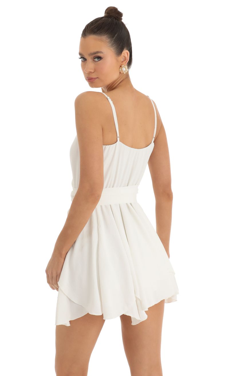 Picture Melody Wrap Skater Dress in Ivory. Source: https://media.lucyinthesky.com/data/Jan23/800xAUTO/0bc8682b-b512-4056-9c44-9464cd3b806d.jpg