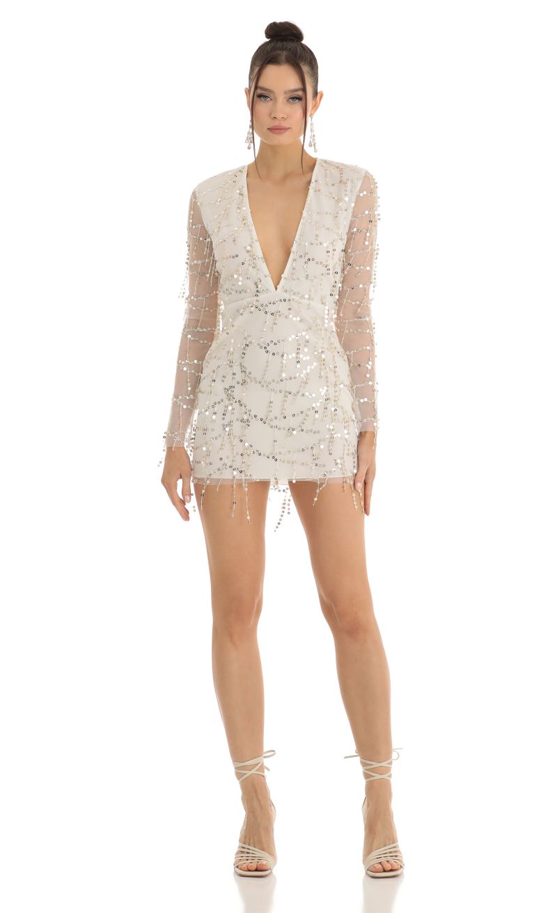 Picture Paris Dangling Sequin Plunge Dress in White. Source: https://media.lucyinthesky.com/data/Jan23/800xAUTO/0d128c38-f8c0-4bb3-aa42-247209c1f3e1.jpg