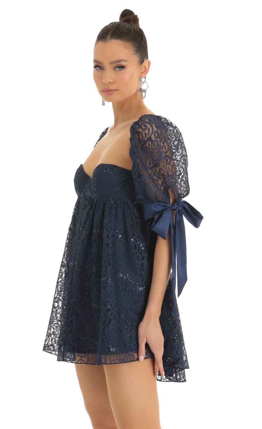 Picture Maia Sequin Lace Baby Doll Dress in Dark Blue. Source: https://media.lucyinthesky.com/data/Jan23/850xAUTO/03b591f4-c5ee-4342-842f-a8b776b773de.jpg