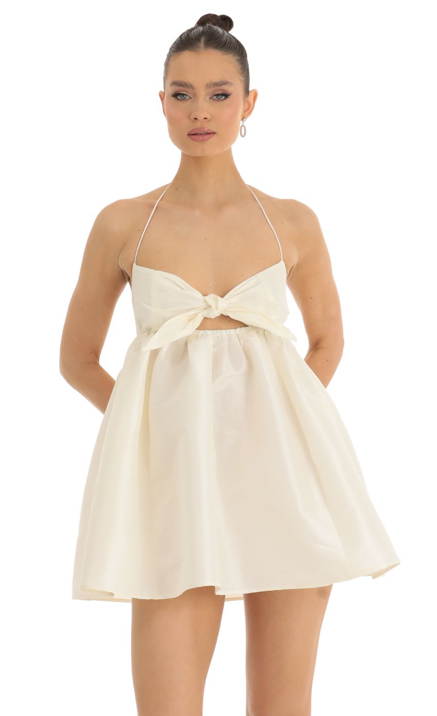 Picture Bellamy Front Tie Baby Doll Dress in Cream. Source: https://media.lucyinthesky.com/data/Jan23/850xAUTO/1a63aab9-0047-4ea5-988d-9fa39c31cf12.jpg