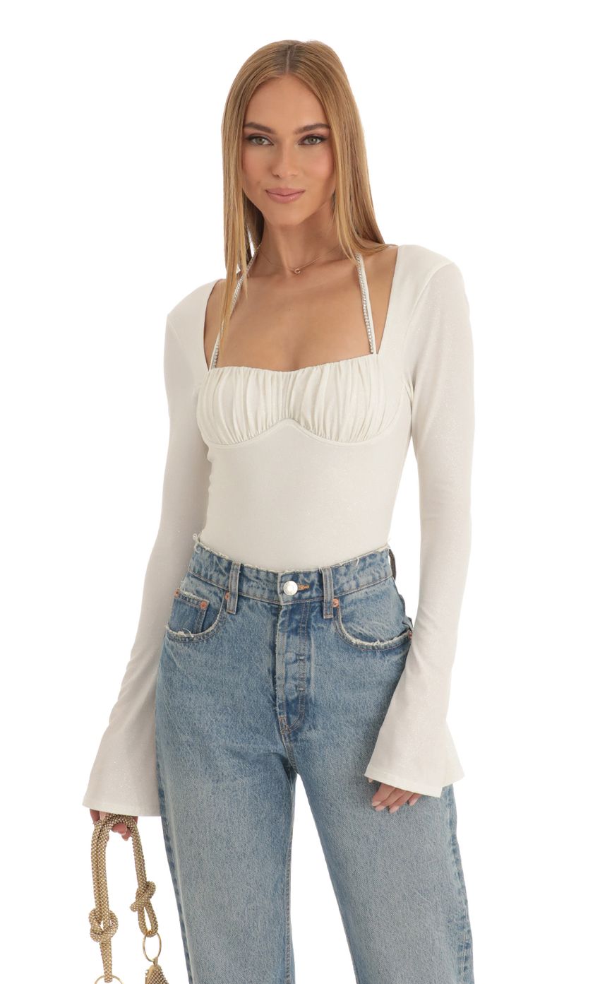 Picture Lexa Glitter Flare Long Sleeve Bodysuit in White. Source: https://media.lucyinthesky.com/data/Jan23/850xAUTO/58ccfc84-4475-4ff6-898d-5dba589607a8.jpg