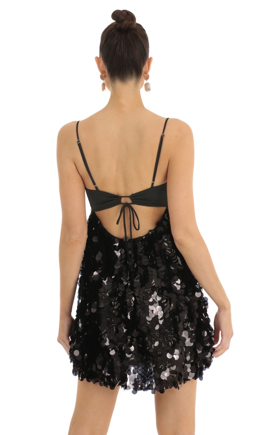 Picture Phalyn Big Sequin Keyhole Baby Doll Dress is Black. Source: https://media.lucyinthesky.com/data/Jan23/850xAUTO/629965e7-09a5-4ae5-a8fb-142dc496d6a2.jpg
