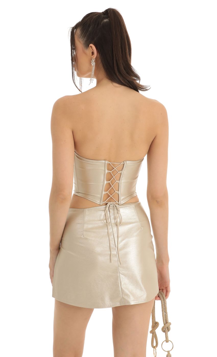 Picture Elia PU Leather Two Piece Skirt Set in Gold. Source: https://media.lucyinthesky.com/data/Jan23/850xAUTO/75f9cb39-6ce3-408d-8d8e-875dc469ce4f.jpg
