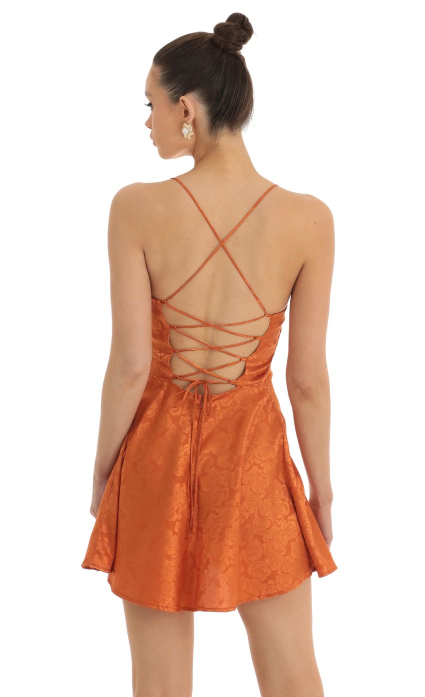 Picture Rowena Floral Jacquard A-Line Dress in Orange. Source: https://media.lucyinthesky.com/data/Jan23/850xAUTO/8919c019-925e-4400-aade-0c0bee178b0b.jpg