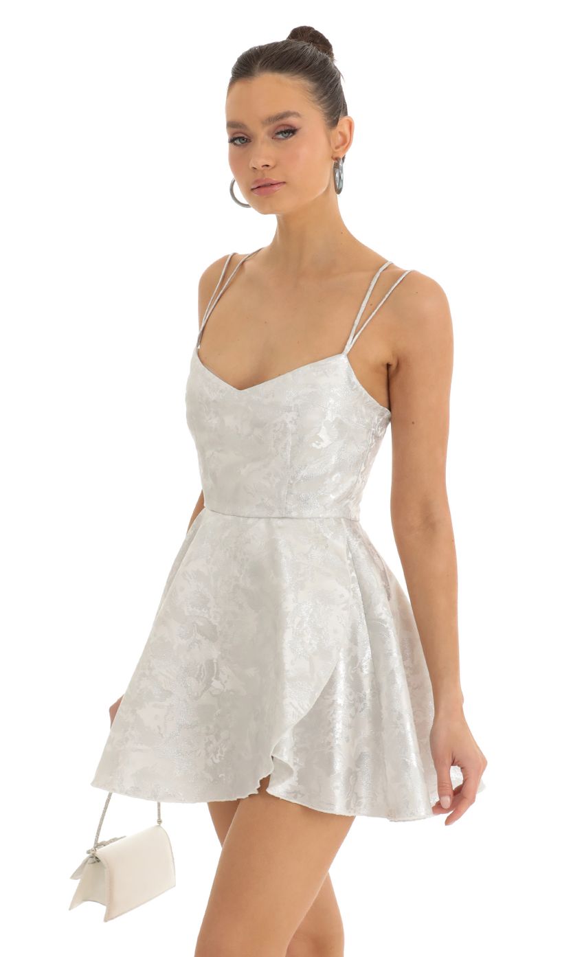 Picture Calem Glitter Jacquard Cross Back Dress in Silver. Source: https://media.lucyinthesky.com/data/Jan23/850xAUTO/a61dabd0-985a-4b66-af0c-f56fadc28c3c.jpg