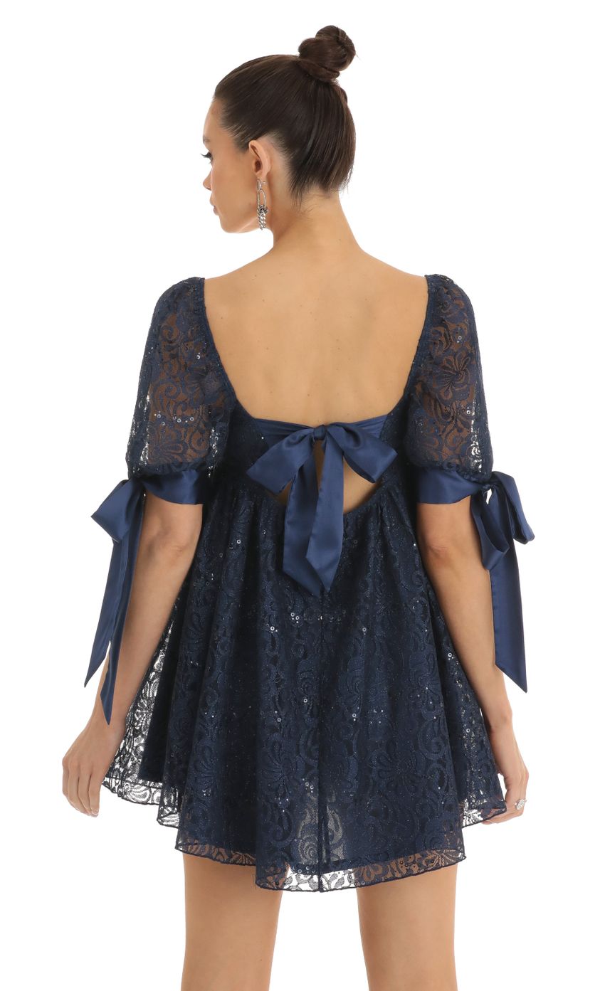 Picture Maia Sequin Lace Baby Doll Dress in Dark Blue. Source: https://media.lucyinthesky.com/data/Jan23/850xAUTO/ad992490-efe5-4d33-8393-3a14b4cfb3e3.jpg