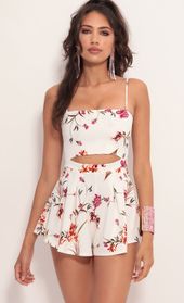 Picture thumb Juliana Cutout Romper in White Floral. Source: https://media.lucyinthesky.com/data/Jul19_2/170xAUTO/781A0878.JPG