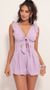 Picture Blair Front Tie Romper in Lilac. Source: https://media.lucyinthesky.com/data/Jul19_2/50x90/781A0242.JPG