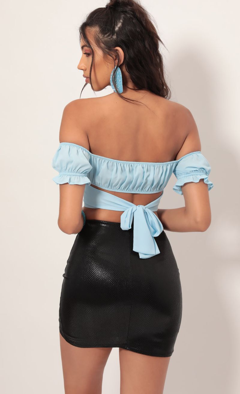Picture Mariana Ruched Wrap Top in Sky Blue. Source: https://media.lucyinthesky.com/data/Jul19_2/800xAUTO/781A2661.JPG