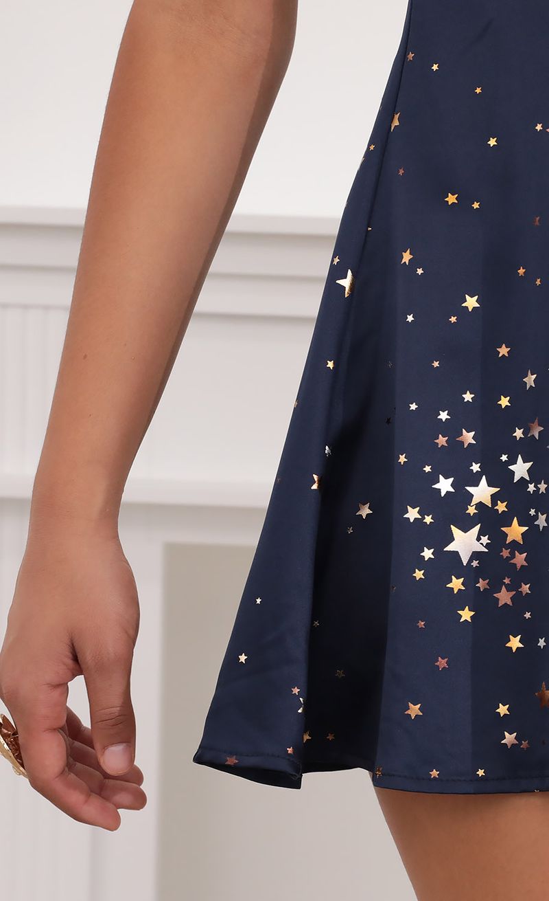 Picture Aida Puff Sleeve Dress in Midnight Satin and Stars. Source: https://media.lucyinthesky.com/data/Jul20_2/800xAUTO/781A3618.JPG