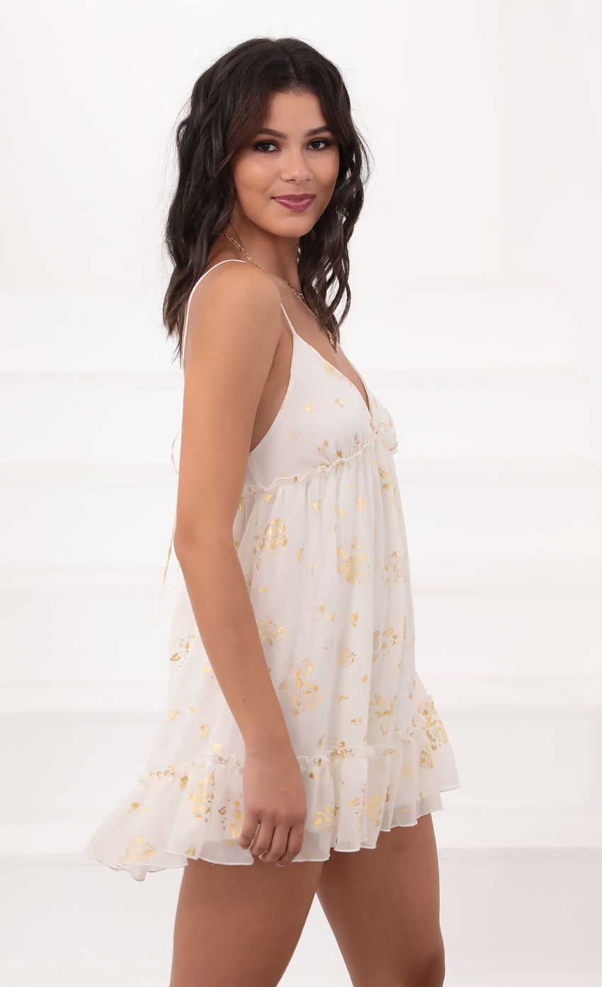 Picture Rosa Day Dress in Ivory and Gold Detailing. Source: https://media.lucyinthesky.com/data/Jul20_2/850xAUTO/781A9172.JPG