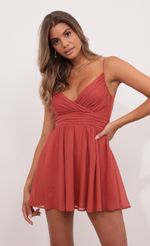 Picture Eliza Chiffon A-Line Dress in Rust. Source: https://media.lucyinthesky.com/data/Jul21_2/150xAUTO/1V9A3250.JPG