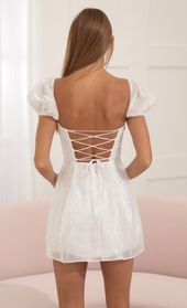 Picture thumb Margie Glitter Puff Sleeve Dress in White. Source: https://media.lucyinthesky.com/data/Jul22/170xAUTO/5e05d94a-978e-407d-894d-849dbe51d598.jpg