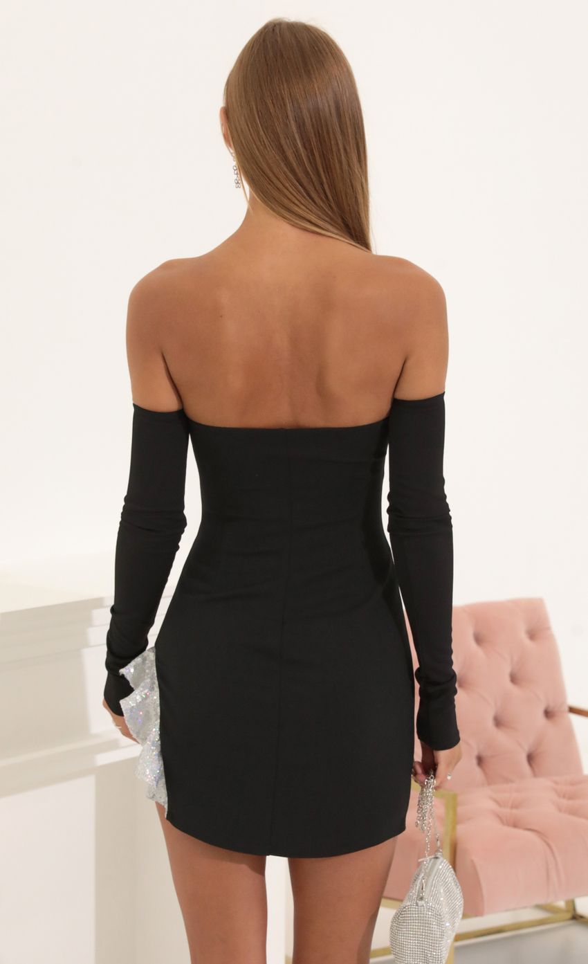 Picture Regina Sequin Ruffle Dress in Black. Source: https://media.lucyinthesky.com/data/Jul22/850xAUTO/3237c8a8-80cc-48a9-9156-bee9fa8fd404.jpg