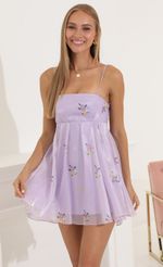 Picture Presley Floral Shiny Organza Baby Doll Dress in Purple. Source: https://media.lucyinthesky.com/data/Jul22_1/150xAUTO/1V9A8128.JPG