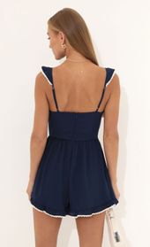Picture thumb Jane Wooldoby Ruffle Romper in Navy. Source: https://media.lucyinthesky.com/data/Jul22_1/170xAUTO/1V9A0115.JPG