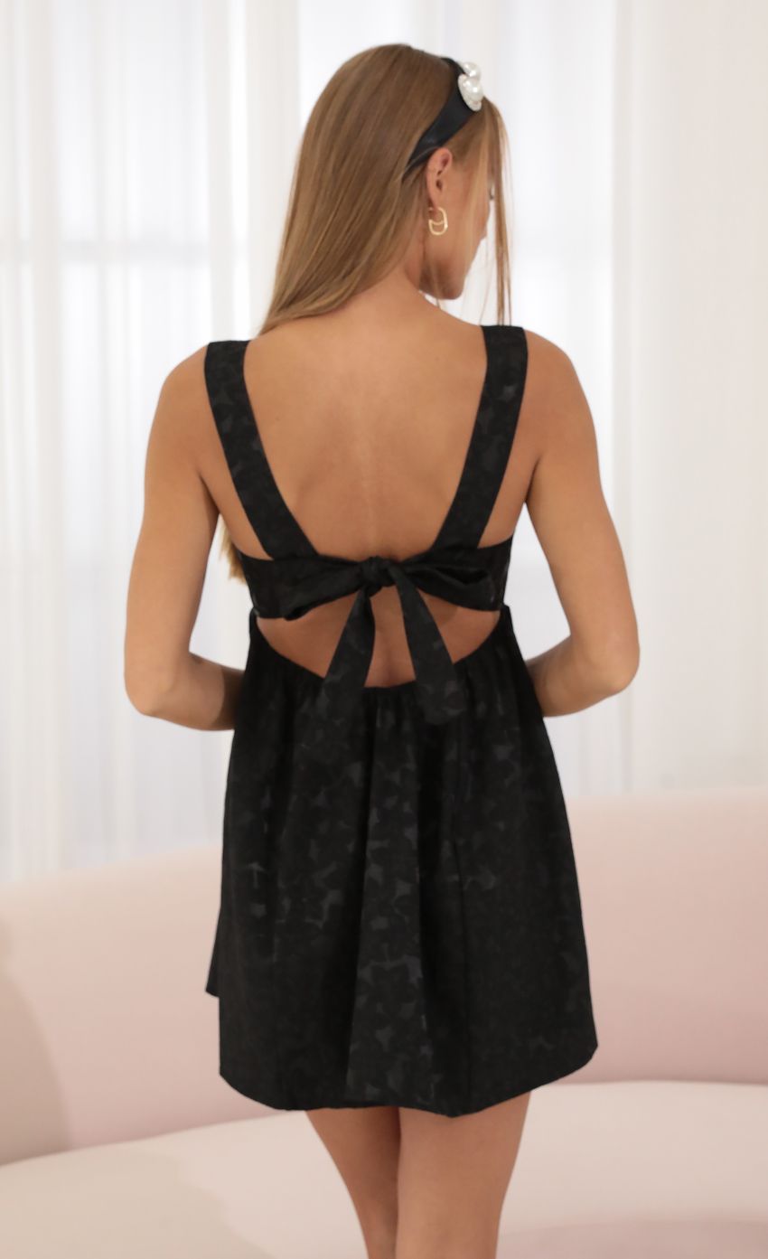 Picture Ivette Floral Jacquard Fit and Flare Dress in Black. Source: https://media.lucyinthesky.com/data/Jul22_1/850xAUTO/1V9A0552.JPG