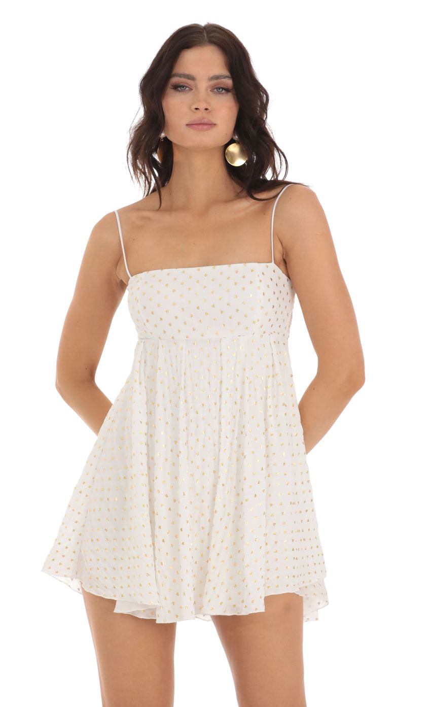 Picture Presley Foiled Heart Baby Doll Dress in White. Source: https://media.lucyinthesky.com/data/Jul23/850xAUTO/68ed25b2-186e-48d8-8849-b1cd59089fed.jpg