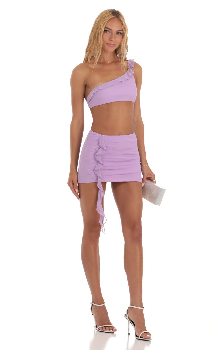 Picture Rumer Fringe One Shoulder Two Piece Set in Purple. Source: https://media.lucyinthesky.com/data/Jul23/850xAUTO/da1ce556-c412-4e0e-aee3-88393d671936.jpg