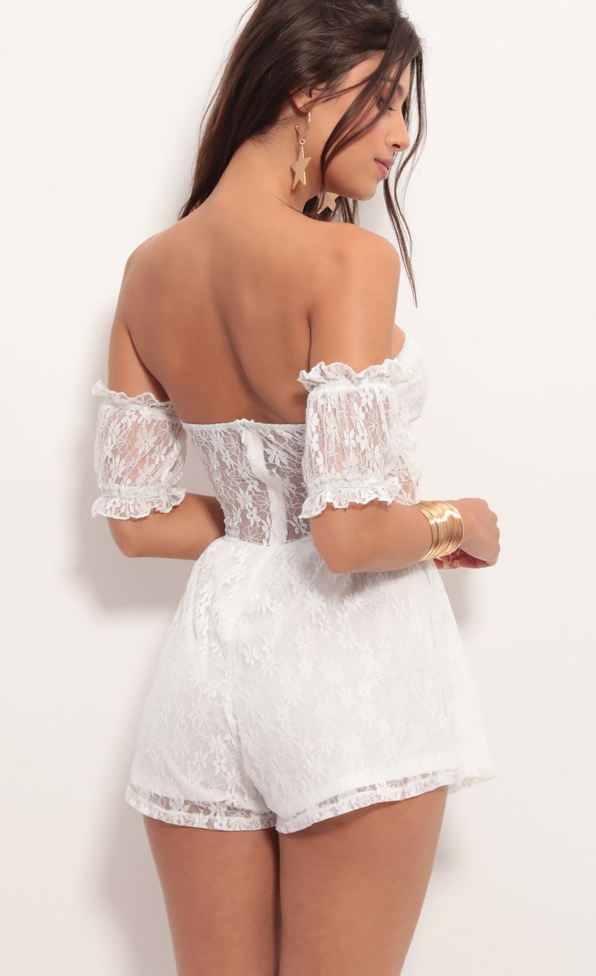Picture Hailee Dainty Lace Romper in White. Source: https://media.lucyinthesky.com/data/Jun19_1/850xAUTO/781A4564.JPG