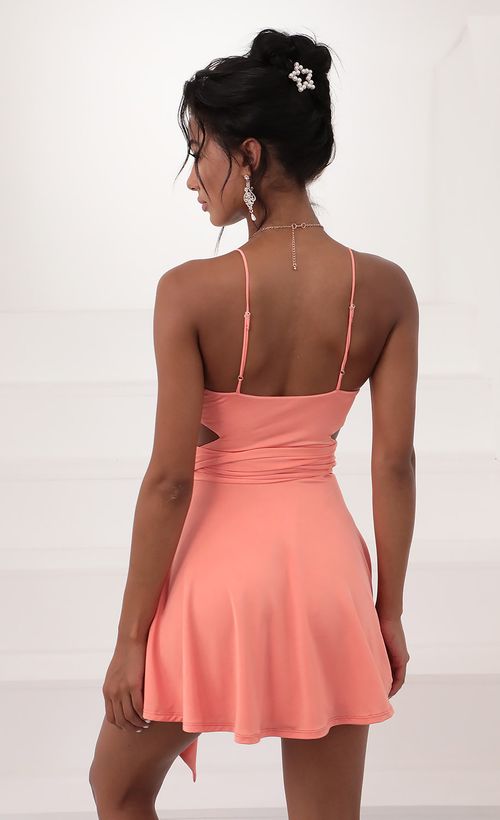 Picture Aliah Wrap Dress in Coral. Source: https://media.lucyinthesky.com/data/Jun20_2/500xAUTO/781A5622.JPG