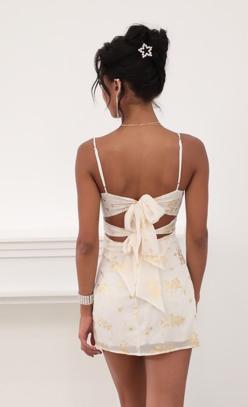 Picture Evelyn Front Twist Chiffon Dress in Gold Rose Print. Source: https://media.lucyinthesky.com/data/Jun20_2/500xAUTO/781A7020.JPG