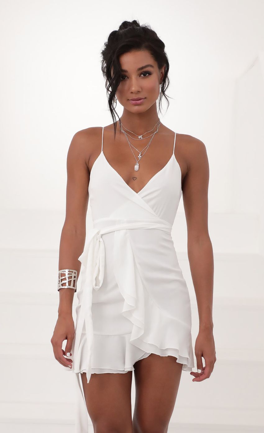 Picture Becca Wrap Ruffle Dress in White. Source: https://media.lucyinthesky.com/data/Jun20_2/850xAUTO/781A2727.JPG