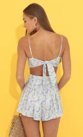 Picture thumb Bella Floral Pleated Romper in Blue. Source: https://media.lucyinthesky.com/data/Jun22_1/170xAUTO/1V9A0857.JPG