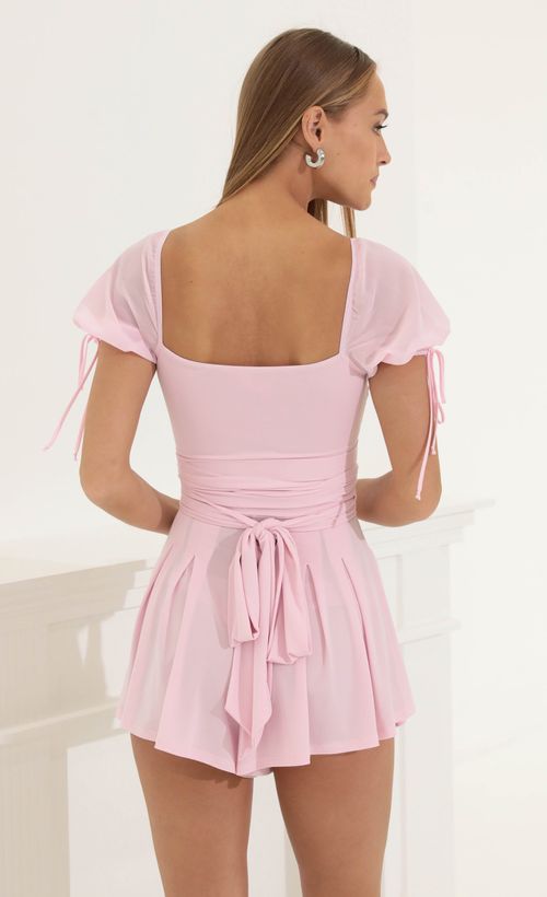 Picture Mirabel Chiffon Puff Sleeve Romper in Pink. Source: https://media.lucyinthesky.com/data/Jun22_1/500xAUTO/1V9A3530.JPG