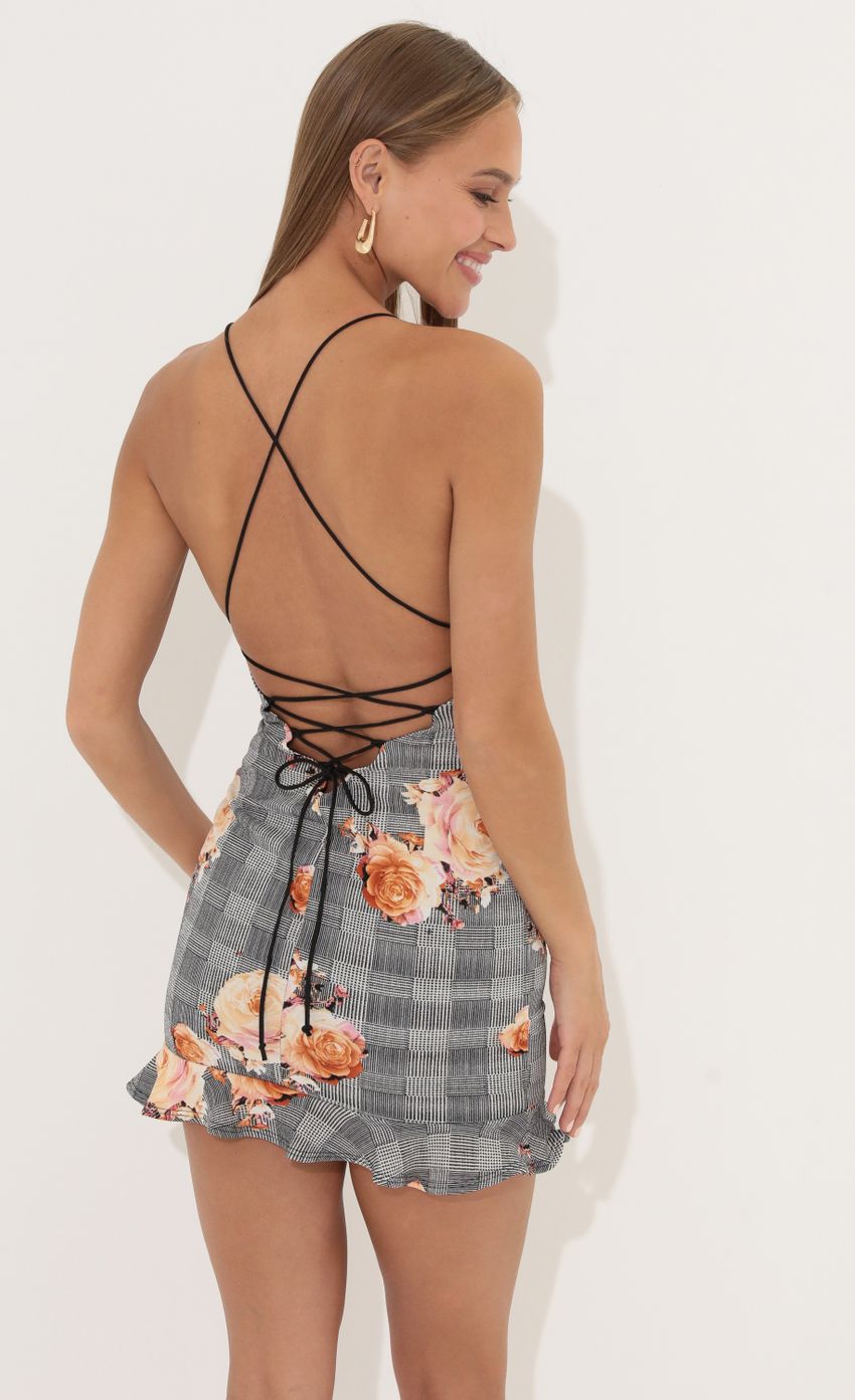Picture Caela Floral Print Ruffle Dress in Black. Source: https://media.lucyinthesky.com/data/Jun22_1/850xAUTO/1V9A8081.JPG
