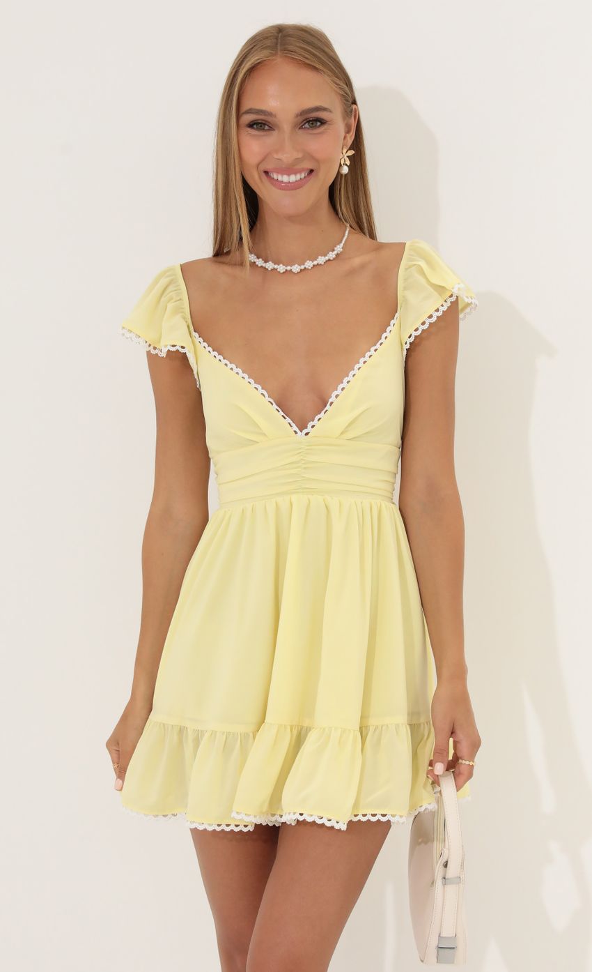 Picture Gaby Fit and Flare Chiffon Dress in Yellow. Source: https://media.lucyinthesky.com/data/Jun22_2/850xAUTO/1V9A4595.JPG