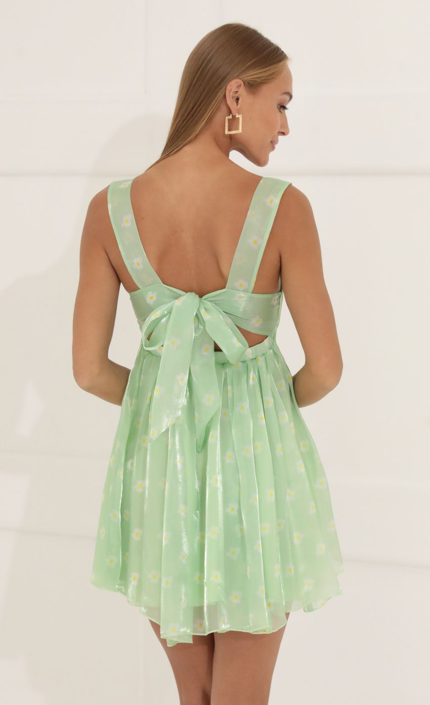 Picture Jennifer Floral Organza Baby Doll Dress in Green. Source: https://media.lucyinthesky.com/data/Jun22_2/850xAUTO/1V9A4864.JPG