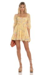 Picture Neia Floral Ruffle Dress in Yellow. Source: https://media.lucyinthesky.com/data/Jun23/150xAUTO/f26113bc-bf68-4499-a2f0-90d1e392d1c2.jpg