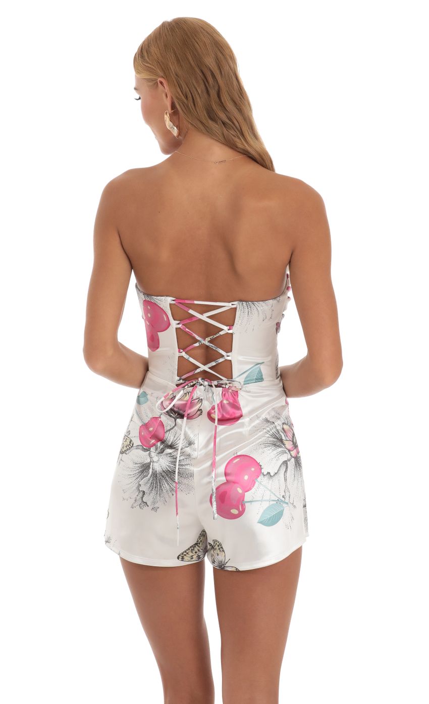 Picture Sinéad Cherry Butterfly Strapless Romper in White. Source: https://media.lucyinthesky.com/data/Jun23/850xAUTO/072b6733-2ca0-4c79-8029-5da91169efbe.jpg