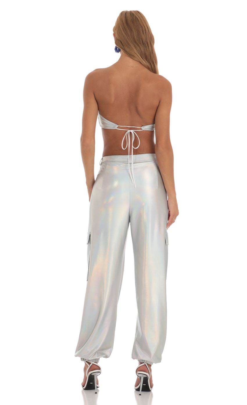 Picture Spacey Holographic Pants in Silver. Source: https://media.lucyinthesky.com/data/Jun23/850xAUTO/2f64031a-90b5-49fa-9fdf-d2578a9ab533.jpg