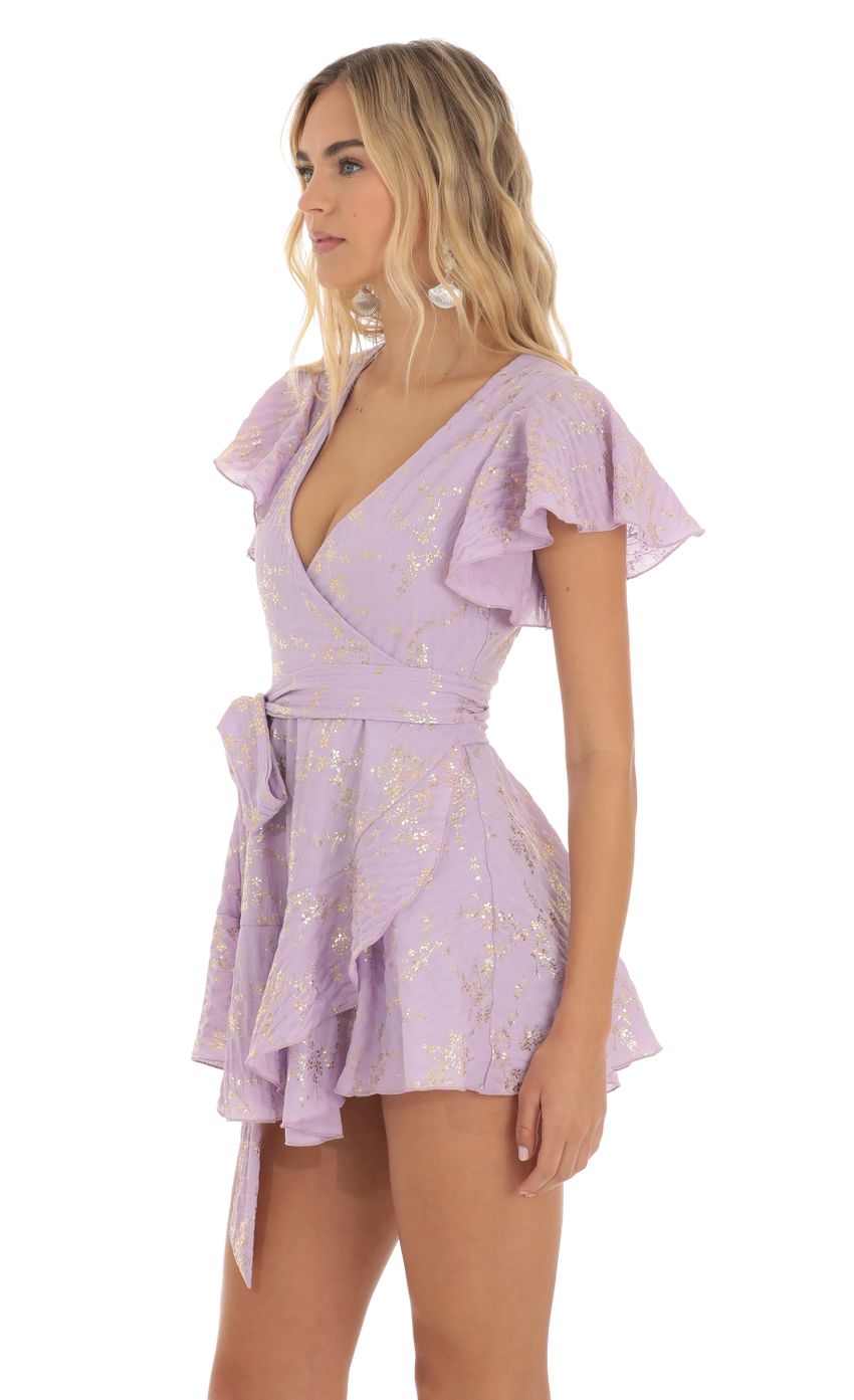 Picture Eliza Shimmer Floral Wrap Dress in Purple. Source: https://media.lucyinthesky.com/data/Jun23/850xAUTO/2fabce20-7e30-482a-8e8f-bcd78aada3ac.jpg
