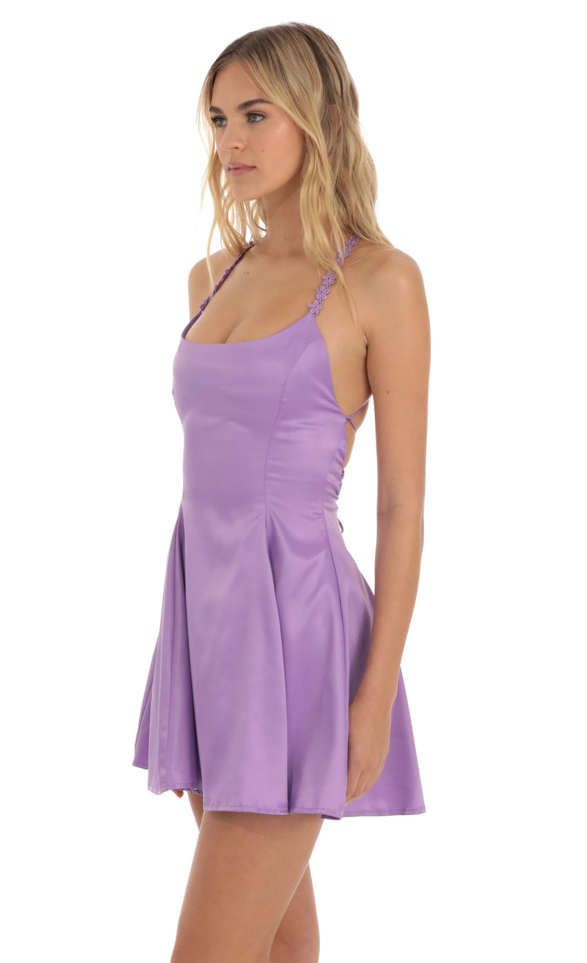 Picture Linnea Satin Floral Flare Dress in Purple. Source: https://media.lucyinthesky.com/data/Jun23/850xAUTO/49a92595-1db9-46f4-a690-cf8317a0a1c8.jpg